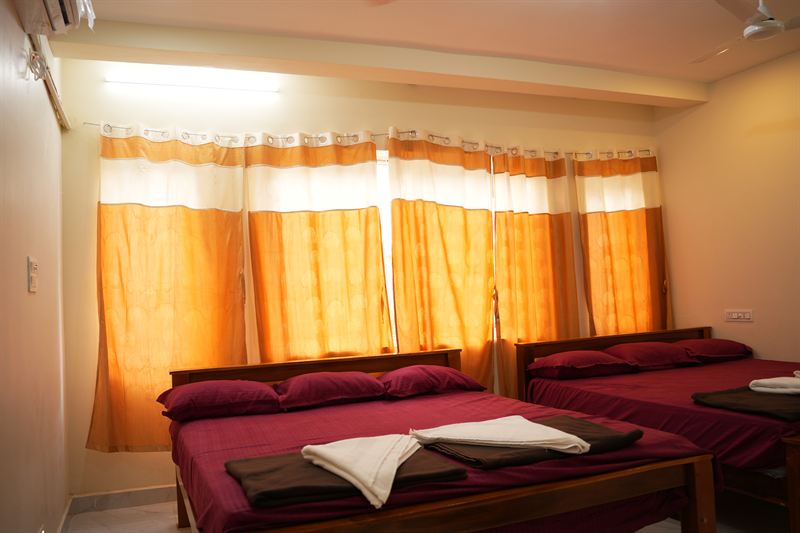 Family room at dusk with curtains glowing warm gold